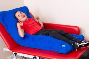 teenager with special needs on Gra ode posture support mattress