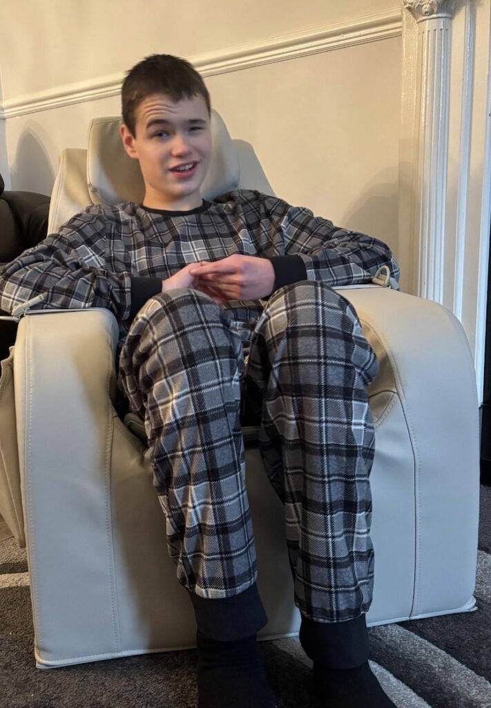 ADHD boy relaxes in Gravity Chair sensory calming seat