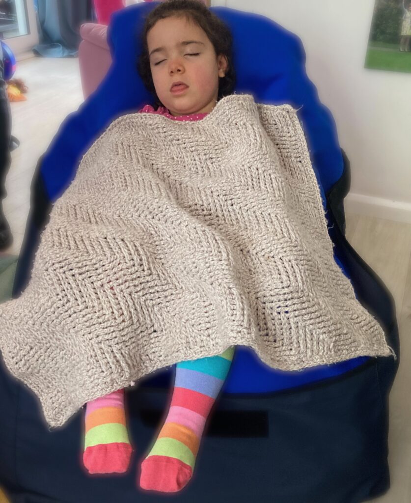 disabled girl asleep on bean bag